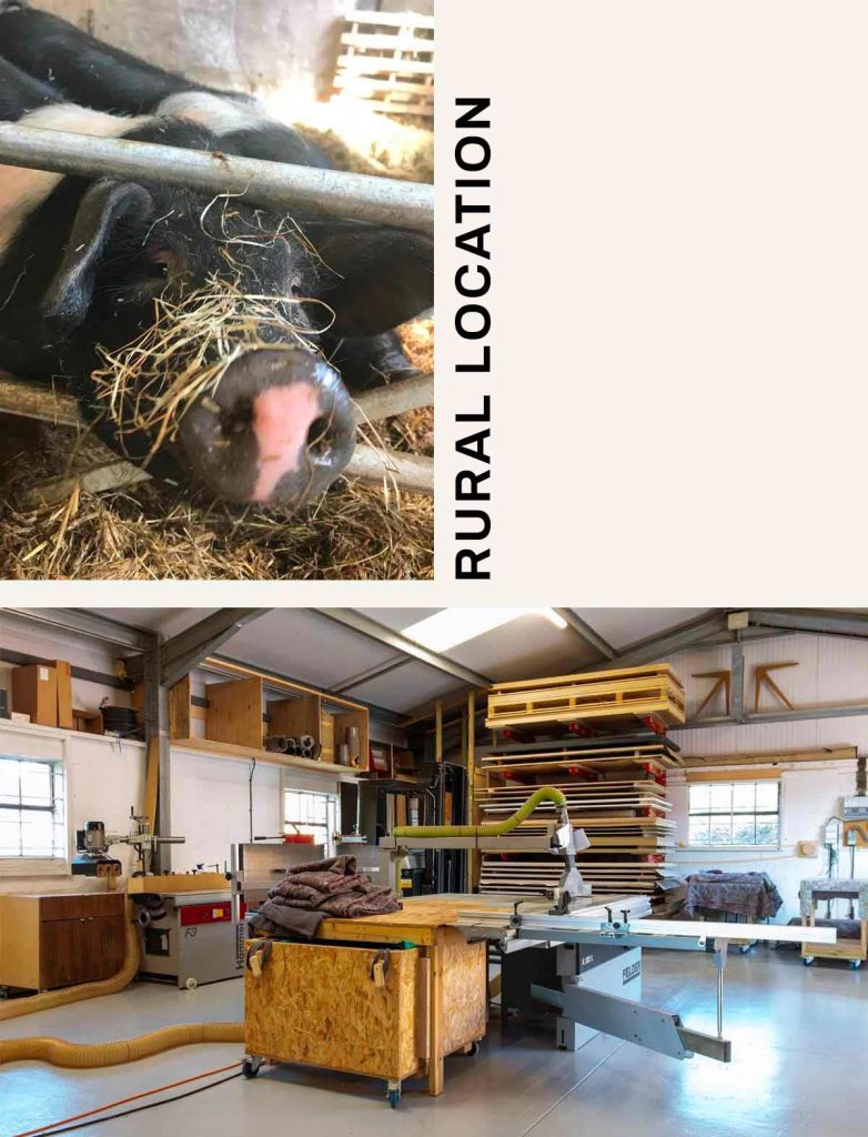 Interior view of a furniture workshop with woodworking equipment and materials in a rural setting.